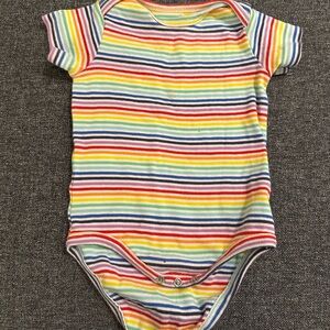 Primary rainbow striped baby onesie